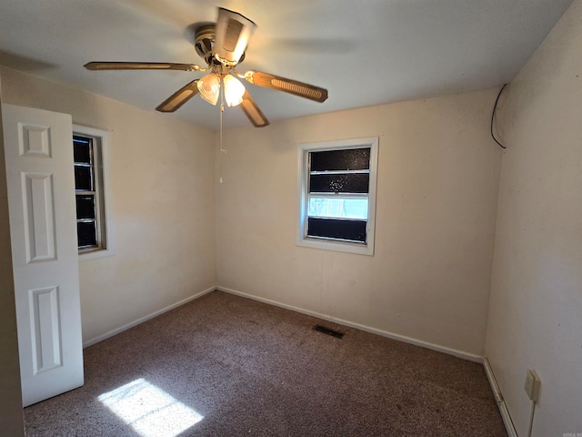 empty room featuring carpet and ceiling fan