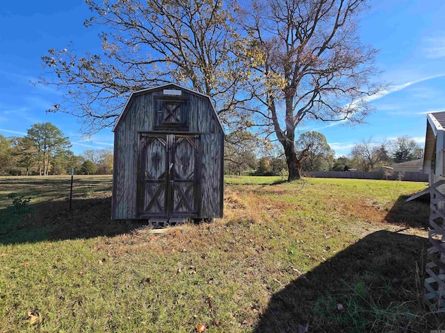 view of outbuilding featuring a lawn