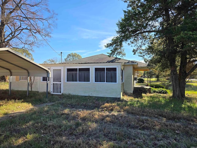 view of side of property featuring a carport