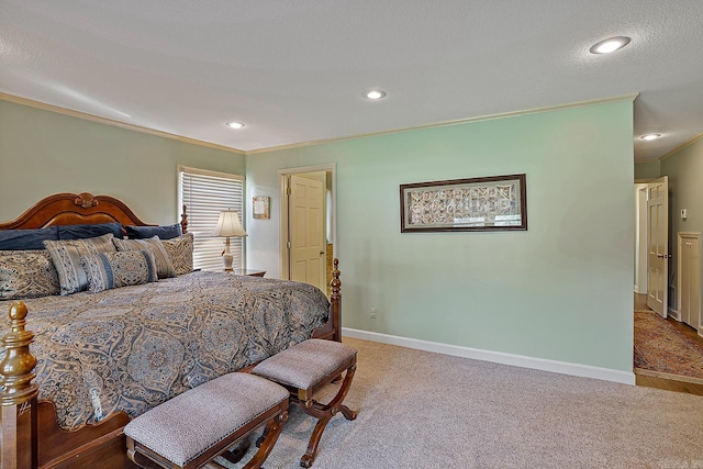 carpeted bedroom featuring a textured ceiling and ornamental molding