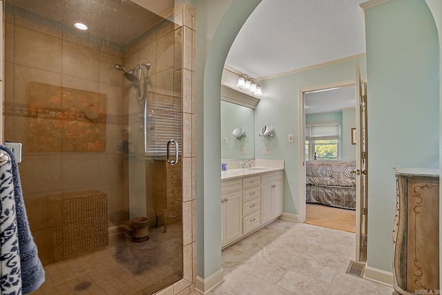 bathroom with walk in shower, ornamental molding, a textured ceiling, vanity, and tile patterned floors