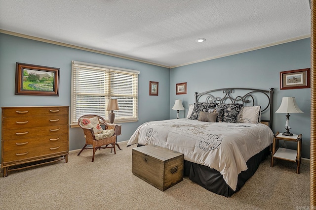 bedroom featuring carpet flooring, a textured ceiling, and crown molding