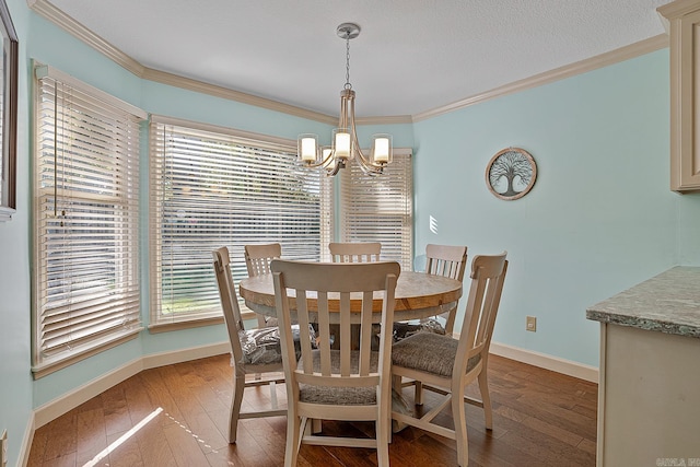 dining area featuring an inviting chandelier, wood-type flooring, and ornamental molding