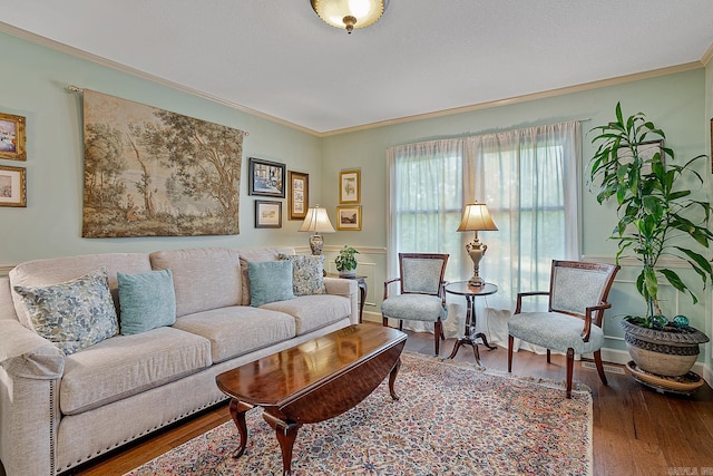 living room featuring ornamental molding and wood-type flooring