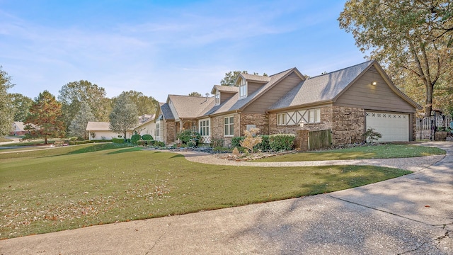 view of front of home with a garage and a front yard