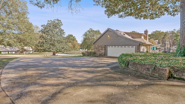 view of side of property featuring a garage