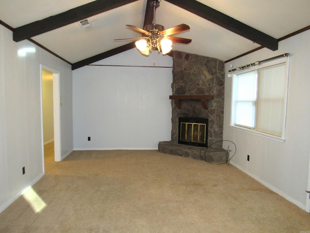 unfurnished living room featuring a stone fireplace, ceiling fan, light carpet, and vaulted ceiling with beams