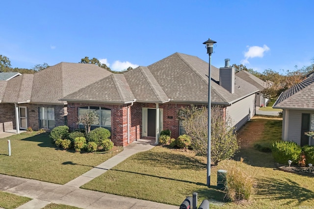 single story home featuring a front yard