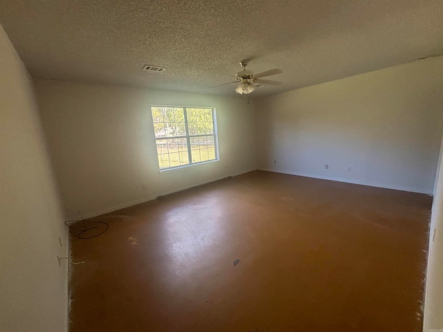 unfurnished room featuring a textured ceiling and ceiling fan