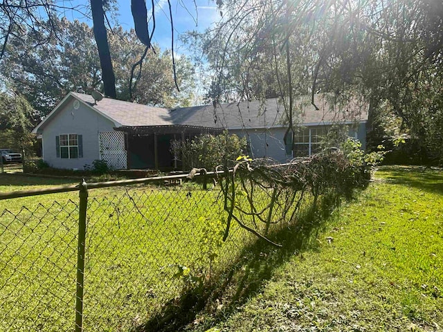 rear view of house with a lawn