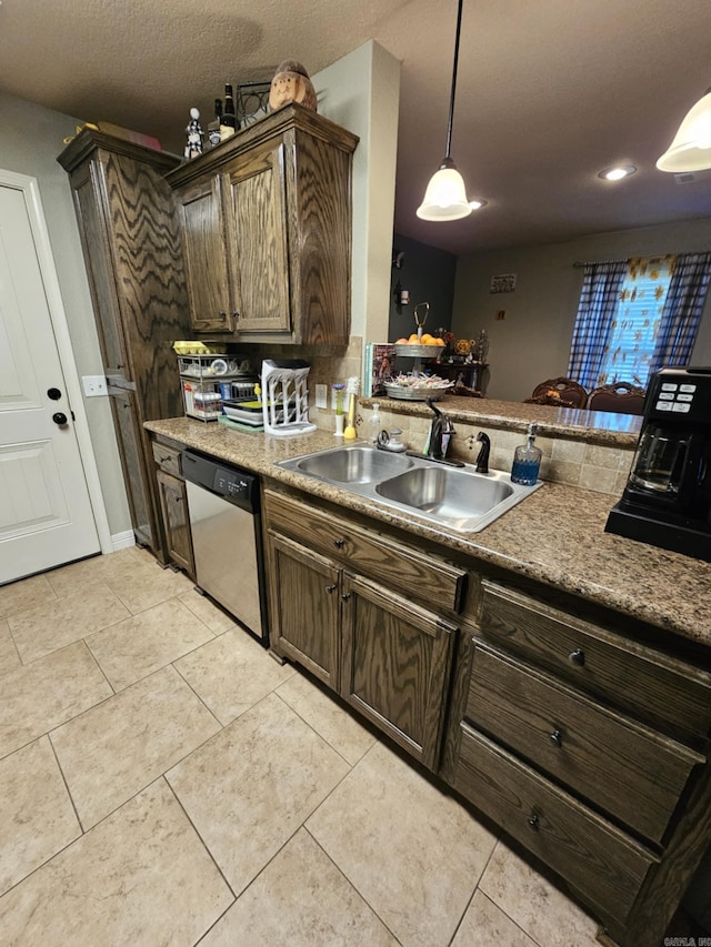 513 Saint Charles Ct, Haskell, AR 72015 - kitchen with stainless steel dishwasher, a sink, light tile patterned flooring, decorative light fixtures, and dark brown cabinets