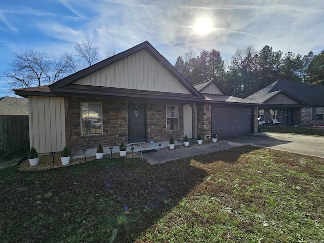 513 Saint Charles Ct, Haskell, AR 72015 - view of front facade with concrete driveway, an attached garage, stone siding, and board and batten siding