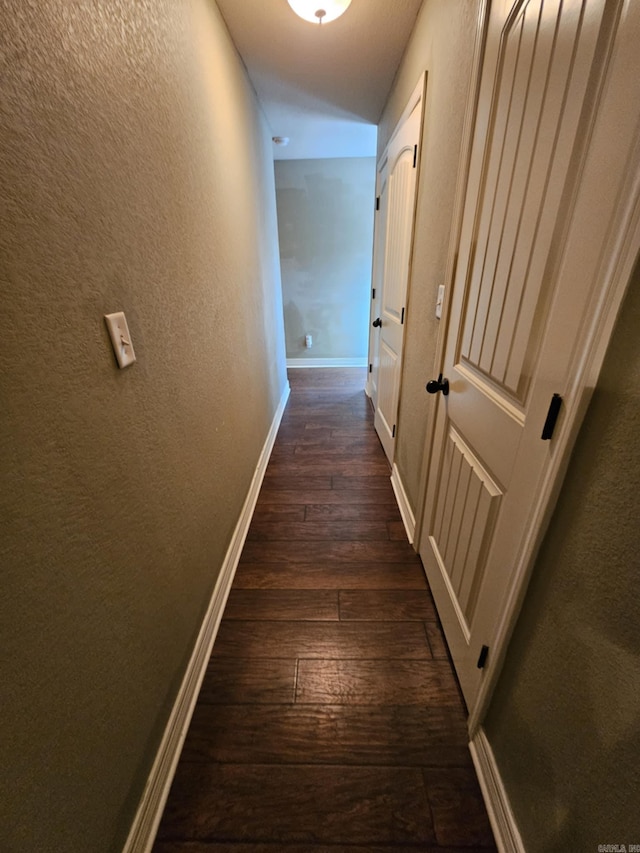 hall with dark hardwood / wood-style floors