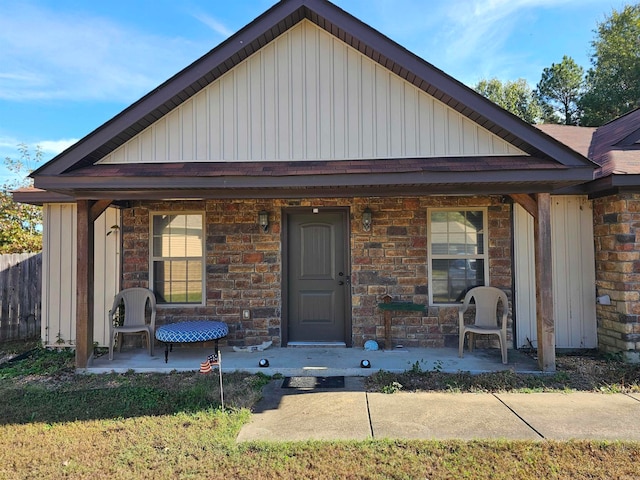 view of front of property with covered porch and a patio area