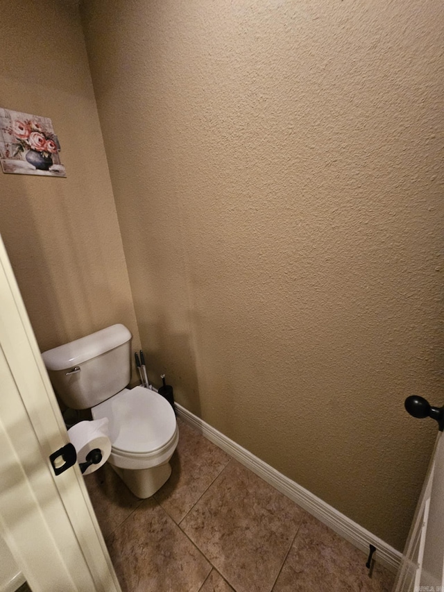 bathroom featuring tile patterned floors and toilet