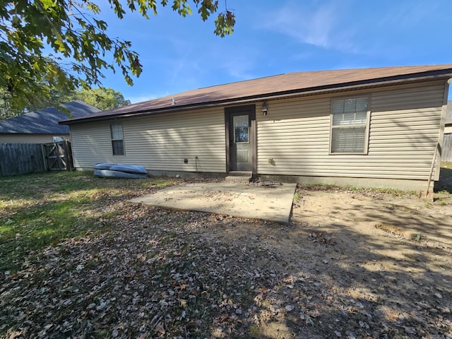 rear view of house featuring a patio