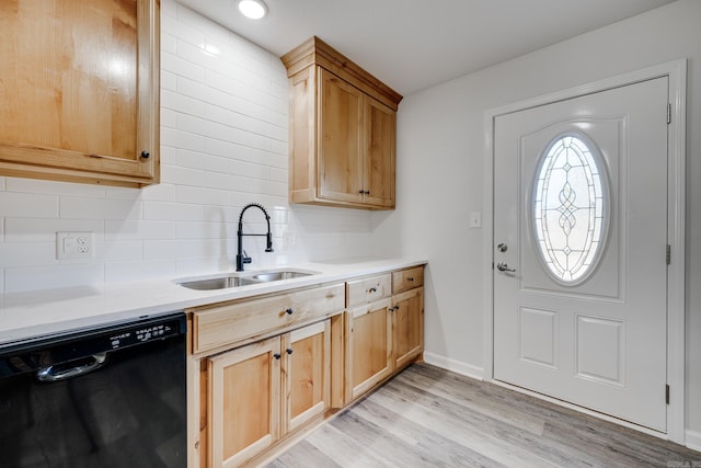 kitchen featuring light wood-type flooring, backsplash, light brown cabinetry, sink, and dishwasher