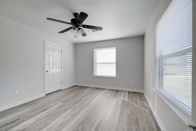 empty room featuring light hardwood / wood-style floors and ceiling fan