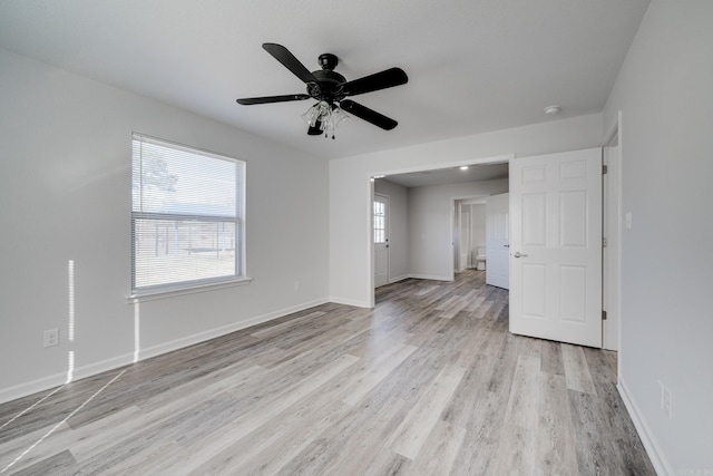 interior space with ceiling fan, light hardwood / wood-style floors, and plenty of natural light