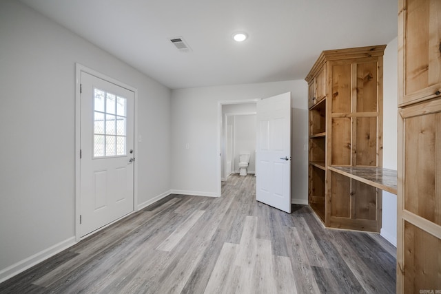 foyer entrance featuring hardwood / wood-style floors