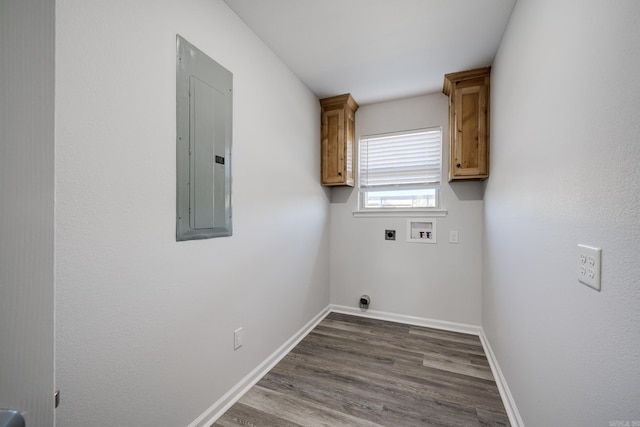 clothes washing area with electric panel, hookup for an electric dryer, washer hookup, dark hardwood / wood-style floors, and cabinets