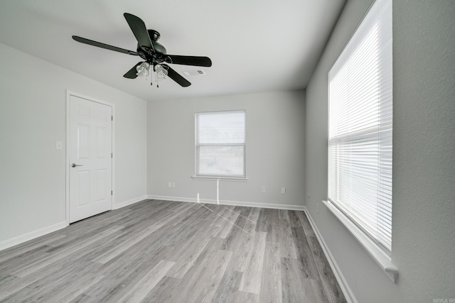 unfurnished room featuring light wood-type flooring and ceiling fan