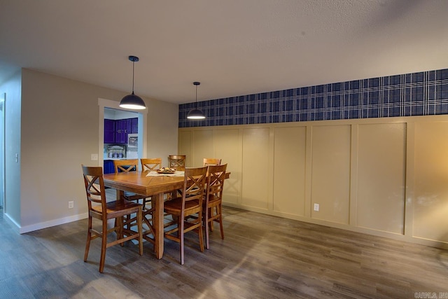 dining area with dark hardwood / wood-style floors