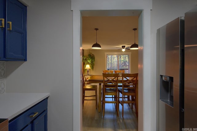 dining room featuring ceiling fan and dark hardwood / wood-style floors