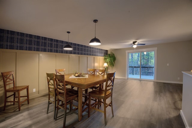 dining space featuring hardwood / wood-style flooring and ceiling fan