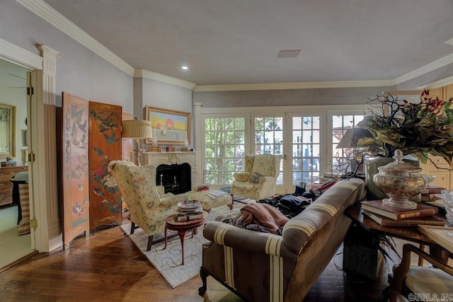 living room featuring wood-type flooring and crown molding