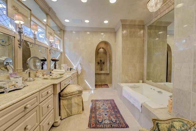 bathroom featuring tile walls, tile patterned flooring, ornamental molding, vanity, and a relaxing tiled tub