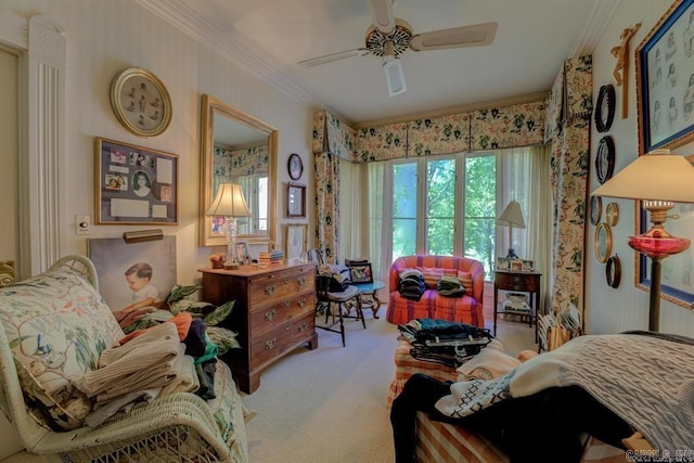 carpeted bedroom featuring ceiling fan and ornamental molding