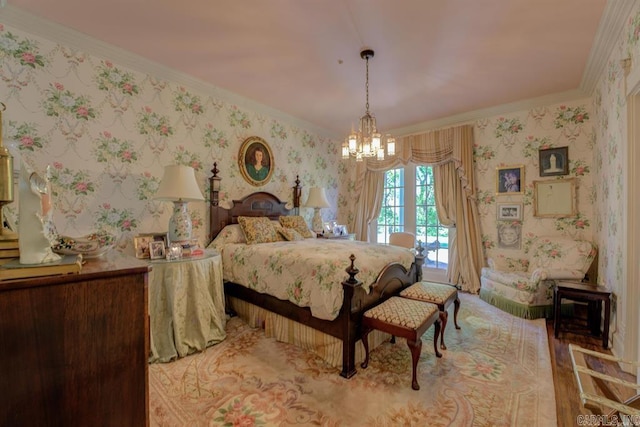 bedroom featuring light wood-type flooring, an inviting chandelier, and ornamental molding