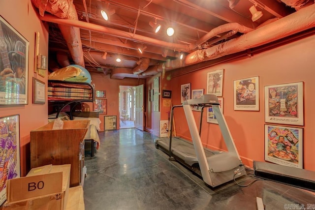 exercise room with concrete floors