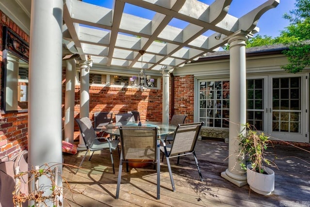 wooden deck featuring french doors and a pergola