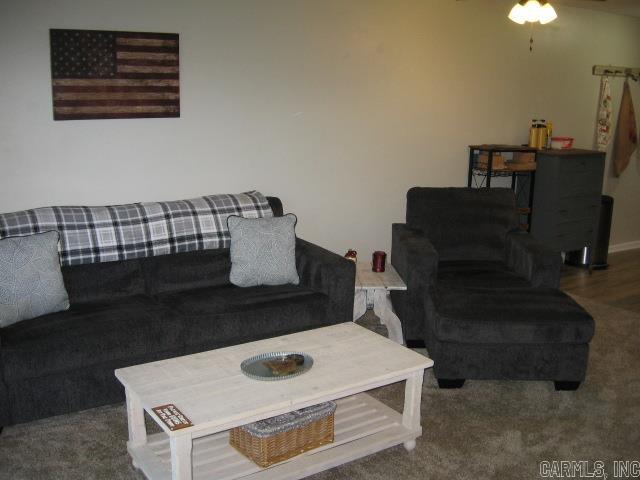 living room featuring ceiling fan