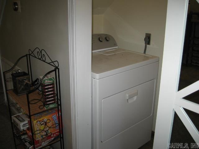 clothes washing area with washer / dryer