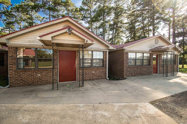 view of front of home featuring a sunroom