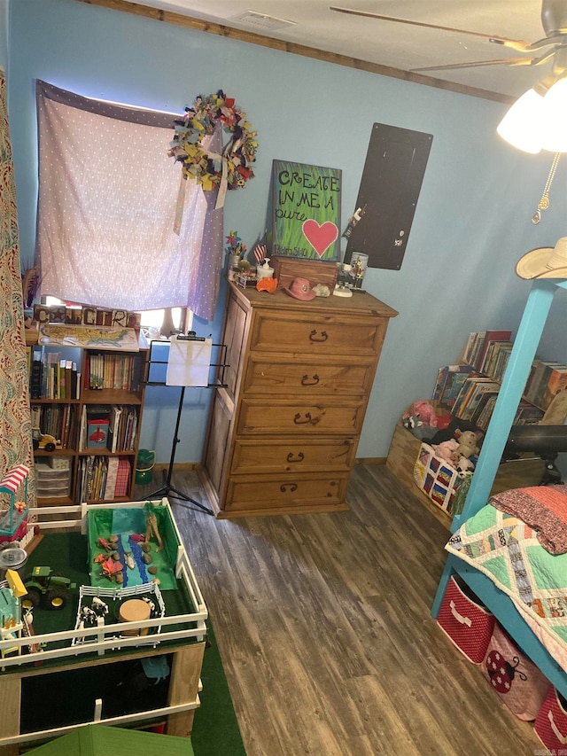 bedroom with dark wood-type flooring