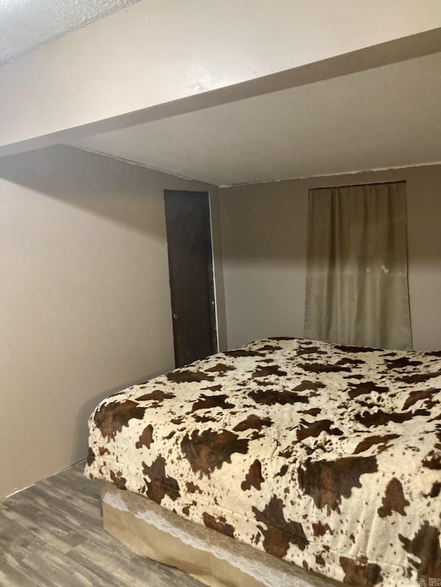 bedroom featuring wood-type flooring