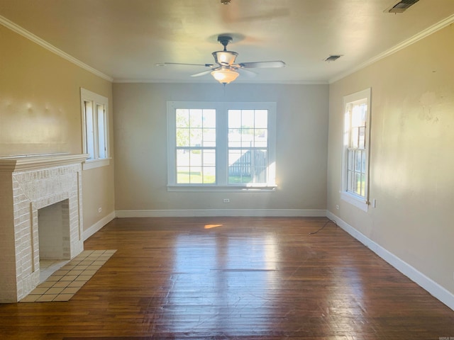 unfurnished living room with ceiling fan, crown molding, dark hardwood / wood-style floors, and a fireplace