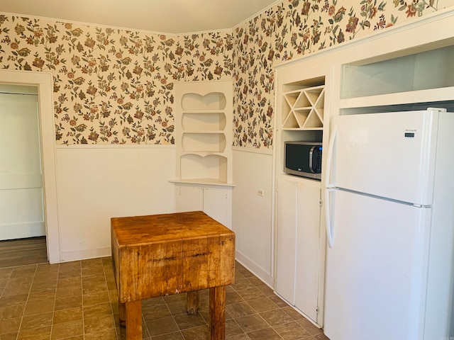 kitchen featuring white fridge