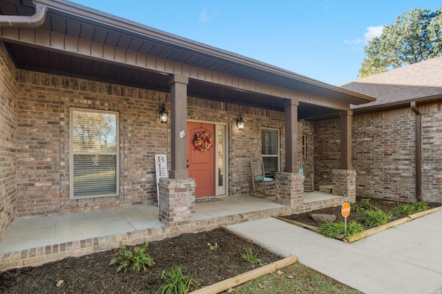 doorway to property featuring covered porch