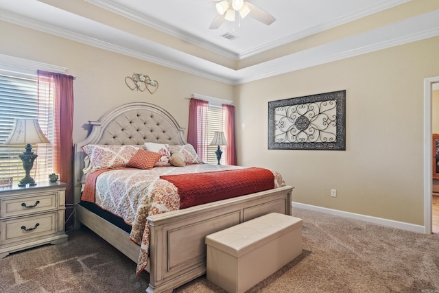 bedroom featuring ceiling fan, multiple windows, dark carpet, and ornamental molding