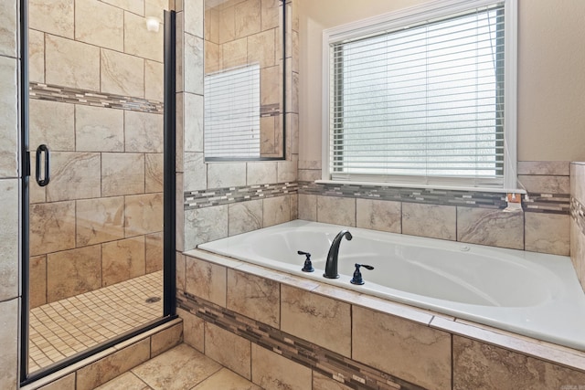 bathroom with tile patterned floors and plus walk in shower