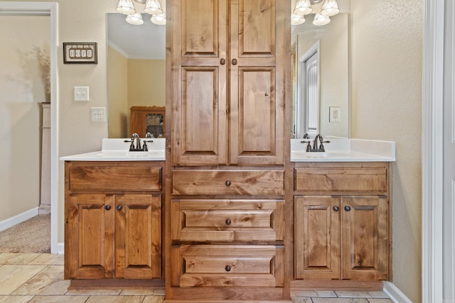 bathroom with ornamental molding and vanity