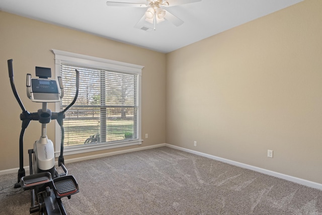 workout area with ceiling fan and carpet flooring