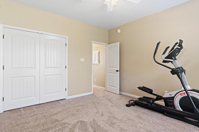 workout area with light carpet and ceiling fan