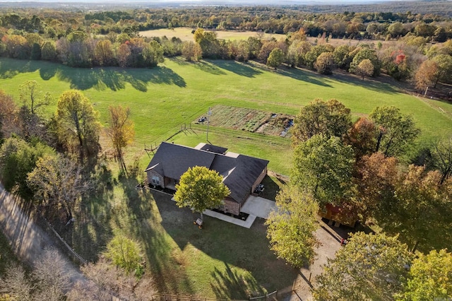 birds eye view of property with a rural view