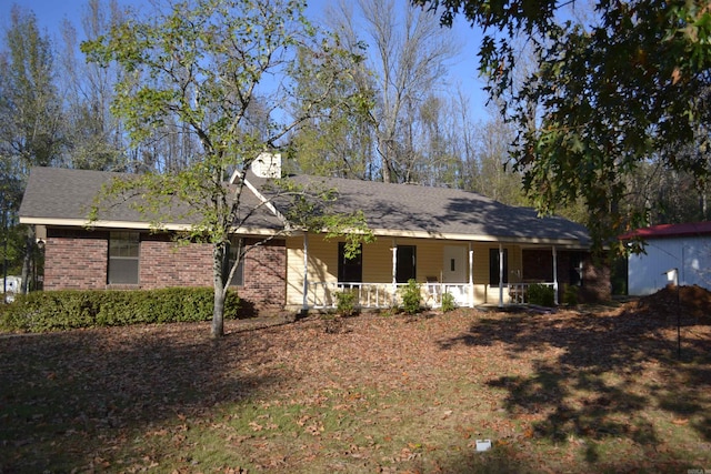 ranch-style house featuring a porch